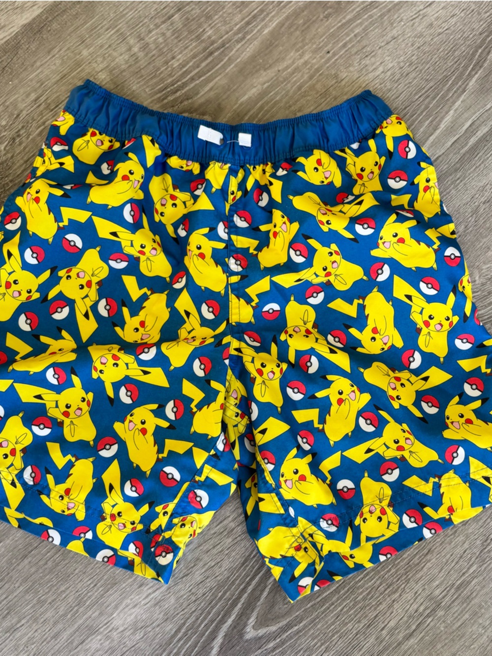 Hanna Andersson Blue and Yellow Pikachu Kids Swim Trunks